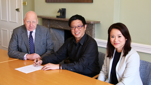 Chris Daly, Kelvin Tong and Norafida Ramlee sign the partnership agreement
