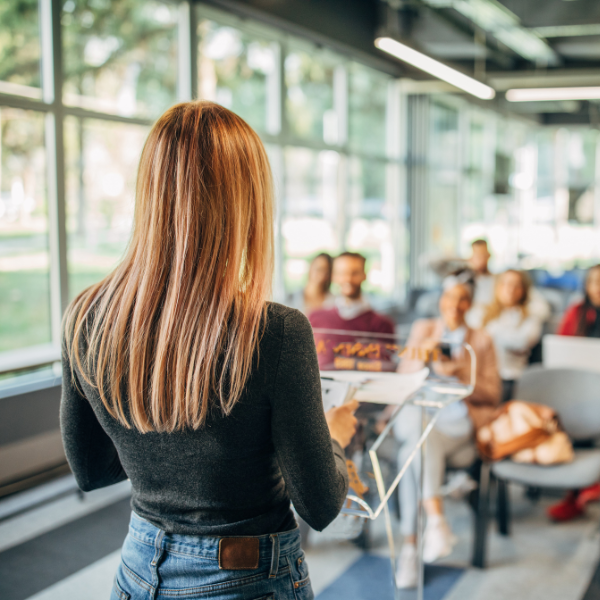 A woman presenting to a class