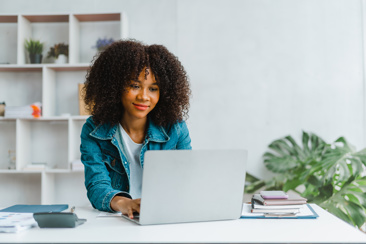 A woman working at a laptop